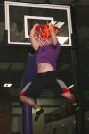 Boy Dunking a Basketball on a Trampoline